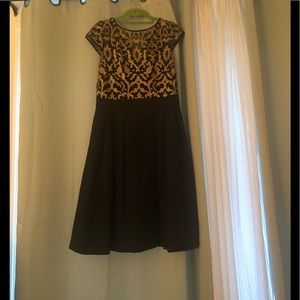 Classic gold and black dress. Mesh gold on top!